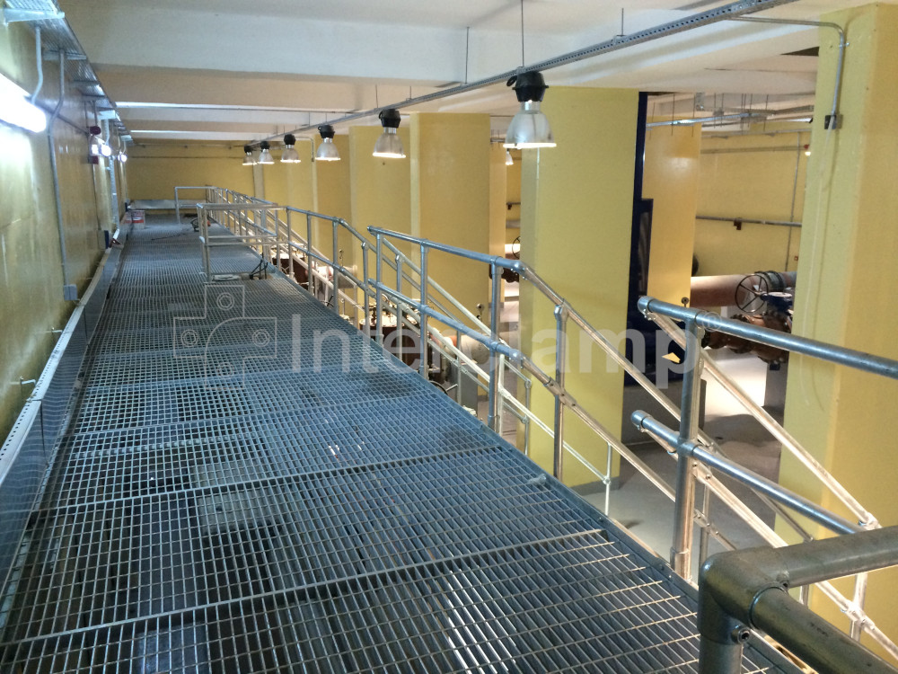 Durable safety balustrades and handrails constructed from Interclamp key clamp fittings at a water treatment works in Kurdistan, safeguarding personnel in a high-risk area.